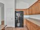 Kitchen has black appliances and ample wood cabinetry at 8312 W Pioneer St, Tolleson, AZ 85353