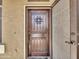 Rustic wooden front door with iron accents at 8312 W Pioneer St, Tolleson, AZ 85353