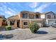 Two-story house with a two-car garage and landscaped yard at 8312 W Pioneer St, Tolleson, AZ 85353