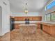 Spacious kitchen with island and wood cabinets at 8312 W Pioneer St, Tolleson, AZ 85353