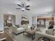 Living room with staged furniture and kitchen access at 8312 W Pioneer St, Tolleson, AZ 85353