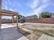 Large backyard with storage shed and concrete patio at 8312 W Pioneer St, Tolleson, AZ 85353