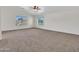 Main bedroom with carpet flooring and large windows at 8312 W Pioneer St, Tolleson, AZ 85353