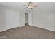 Bright bedroom with double door closet and ceiling fan at 8312 W Pioneer St, Tolleson, AZ 85353