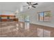 Open concept living room, kitchen combo with tile floors at 8312 W Pioneer St, Tolleson, AZ 85353
