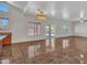 Bright living room with tile floors and access to the backyard at 8312 W Pioneer St, Tolleson, AZ 85353