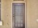 Modern front door with a security screen at 8312 W Pioneer St, Tolleson, AZ 85353