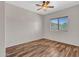 Simple bedroom with wood-look floors at 8312 W Pioneer St, Tolleson, AZ 85353