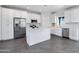 Modern kitchen with white shaker cabinets, stainless steel appliances, and an island at 10784 E Angus Ln, Coolidge, AZ 85128