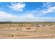 Aerial view of a rural area with various houses and open land at 10784 E Angus Ln, Coolidge, AZ 85128