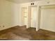 Bedroom with carpeted floor and built-in shelves at 3416 N 44Th St # 5, Phoenix, AZ 85018
