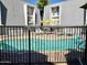 Community pool with surrounding patio furniture at 3416 N 44Th St # 5, Phoenix, AZ 85018