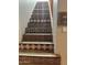 Interior staircase with decorative tile risers and wood treads at 38065 N Cave Creek Rd # 4, Cave Creek, AZ 85331