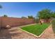 Backyard with grassy area and block wall at 10613 E Emerald Ave, Mesa, AZ 85208