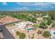 Aerial view of house, pool, tennis court, and playground at 9501 N 52Nd St, Paradise Valley, AZ 85253