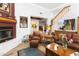 Comfortable living room with fireplace and access to the kitchen at 38065 N Cave Creek Rd # 4, Cave Creek, AZ 85331