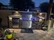 Modern outdoor kitchen with stainless steel appliances and stone accents at 38065 N Cave Creek Rd # 4, Cave Creek, AZ 85331