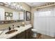 Charming bathroom with copper sink, granite countertop, and decorative mirror at 38065 N Cave Creek Rd # 4, Cave Creek, AZ 85331