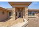 Inviting home exterior with stone accents and a tiled entryway at 10910 E Oro Ave, Mesa, AZ 85212