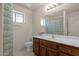 Clean bathroom with wood vanity and a shower/tub combo at 10910 E Oro Ave, Mesa, AZ 85212