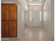 Bright and airy entryway with tile flooring and built-in storage at 10910 E Oro Ave, Mesa, AZ 85212