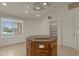 Kitchen island with granite countertop and wood cabinets at 10910 E Oro Ave, Mesa, AZ 85212