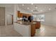 Kitchen island with granite countertop and wood cabinets at 10910 E Oro Ave, Mesa, AZ 85212