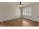 Spacious bedroom with wood flooring and plantation shutters at 10910 E Oro Ave, Mesa, AZ 85212