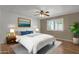Comfortable bedroom with a queen-size bed and window at 10910 E Oro Ave, Mesa, AZ 85212