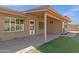 Covered patio with brick pavers and small yard at 10910 E Oro Ave, Mesa, AZ 85212