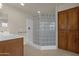 Bathroom with glass block shower and linen closet at 10910 E Oro Ave, Mesa, AZ 85212