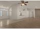 Open living area with tile and wood flooring and access to other rooms at 10910 E Oro Ave, Mesa, AZ 85212