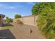 Landscaped backyard with gravel, artificial turf, and desert plants at 10910 E Oro Ave, Mesa, AZ 85212