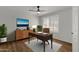 Home office with built-in desk and shelving at 10910 E Oro Ave, Mesa, AZ 85212