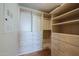 Spacious walk-in closet with ample shelving and drawers at 4422 N 75Th St # 4011, Scottsdale, AZ 85251