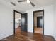 Bedroom with hardwood floors and access to hallway at 4422 N 75Th St # 4011, Scottsdale, AZ 85251