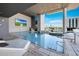 Resort-style pool with lounge chairs and a TV at 4422 N 75Th St # 4011, Scottsdale, AZ 85251
