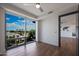 Bedroom with hardwood floors and large window with city view at 4422 N 75Th St # 4011, Scottsdale, AZ 85251
