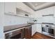 Modern kitchen with stainless steel appliances and white cabinets at 4422 N 75Th St # 4011, Scottsdale, AZ 85251