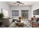 Modern living room with comfortable seating and large TV at 2402 E 5Th St # 1481, Tempe, AZ 85288