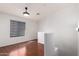 Simple bedroom with wood floors and a window with blinds at 2402 E 5Th St # 1481, Tempe, AZ 85288