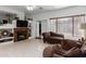 Gathering room with fireplace, built-in shelving, and comfortable seating at 5839 E Jensen St, Mesa, AZ 85205