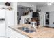 Kitchen features a large island with double sinks and granite countertops at 5839 E Jensen St, Mesa, AZ 85205
