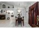 Dining room with marble top table, dark chairs, and burgundy curtains at 5839 E Jensen St, Mesa, AZ 85205