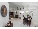 Bright dining area with dark wood table and chairs, adjacent to living room at 5839 E Jensen St, Mesa, AZ 85205