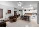 Open kitchen features granite counters, white cabinets, and an island with seating at 5839 E Jensen St, Mesa, AZ 85205
