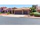 House exterior with tile roof, two-car garage, and manicured landscaping at 5839 E Jensen St, Mesa, AZ 85205