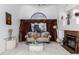 Living room with beige sofa, coffee table, and fireplace at 5839 E Jensen St, Mesa, AZ 85205