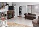Spacious living room with fireplace and access to backyard at 5839 E Jensen St, Mesa, AZ 85205