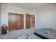 Spacious bedroom with double doors and carpeted floors at 17808 N 57Th Pl, Scottsdale, AZ 85254